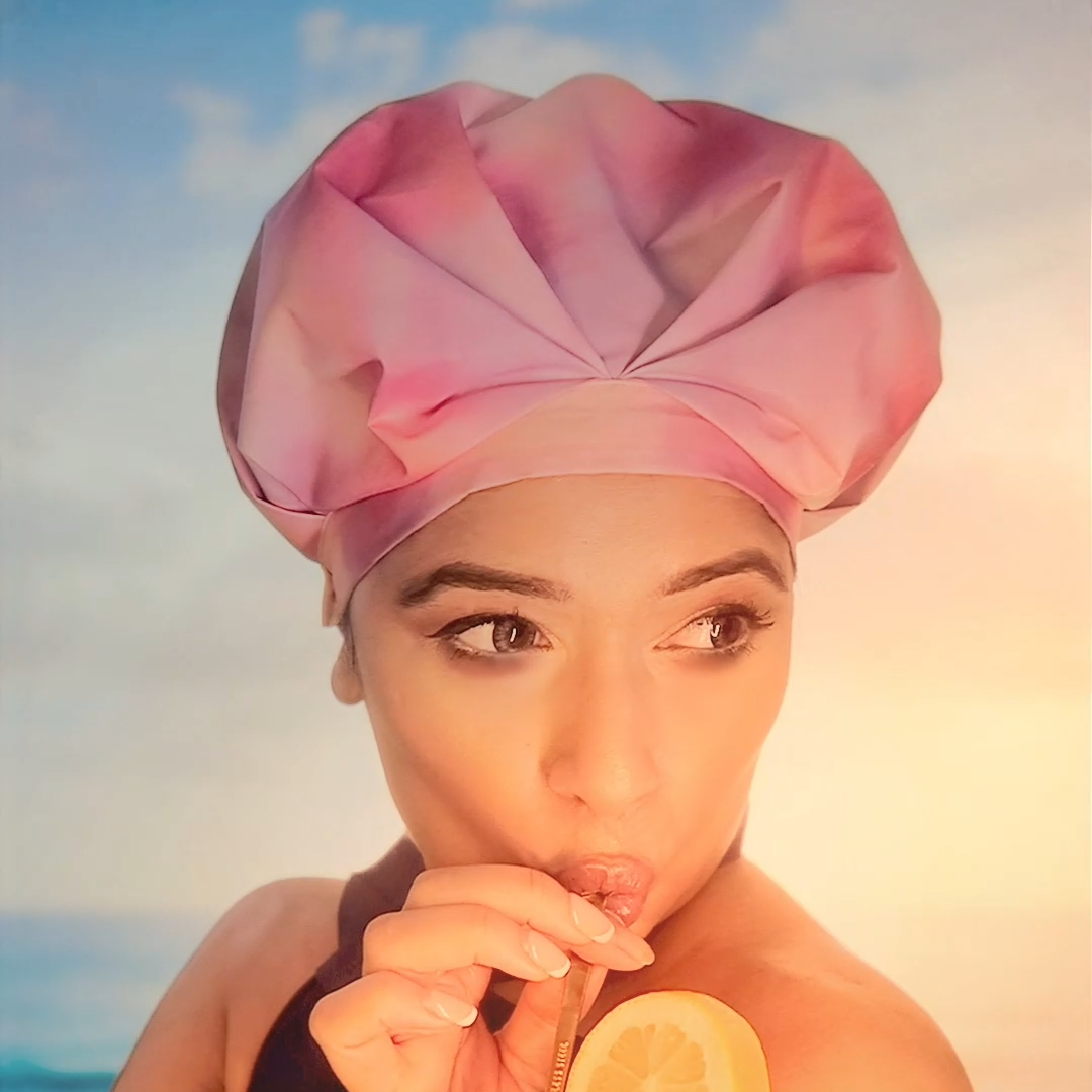 Woman wearing a Musae mane shower cap
