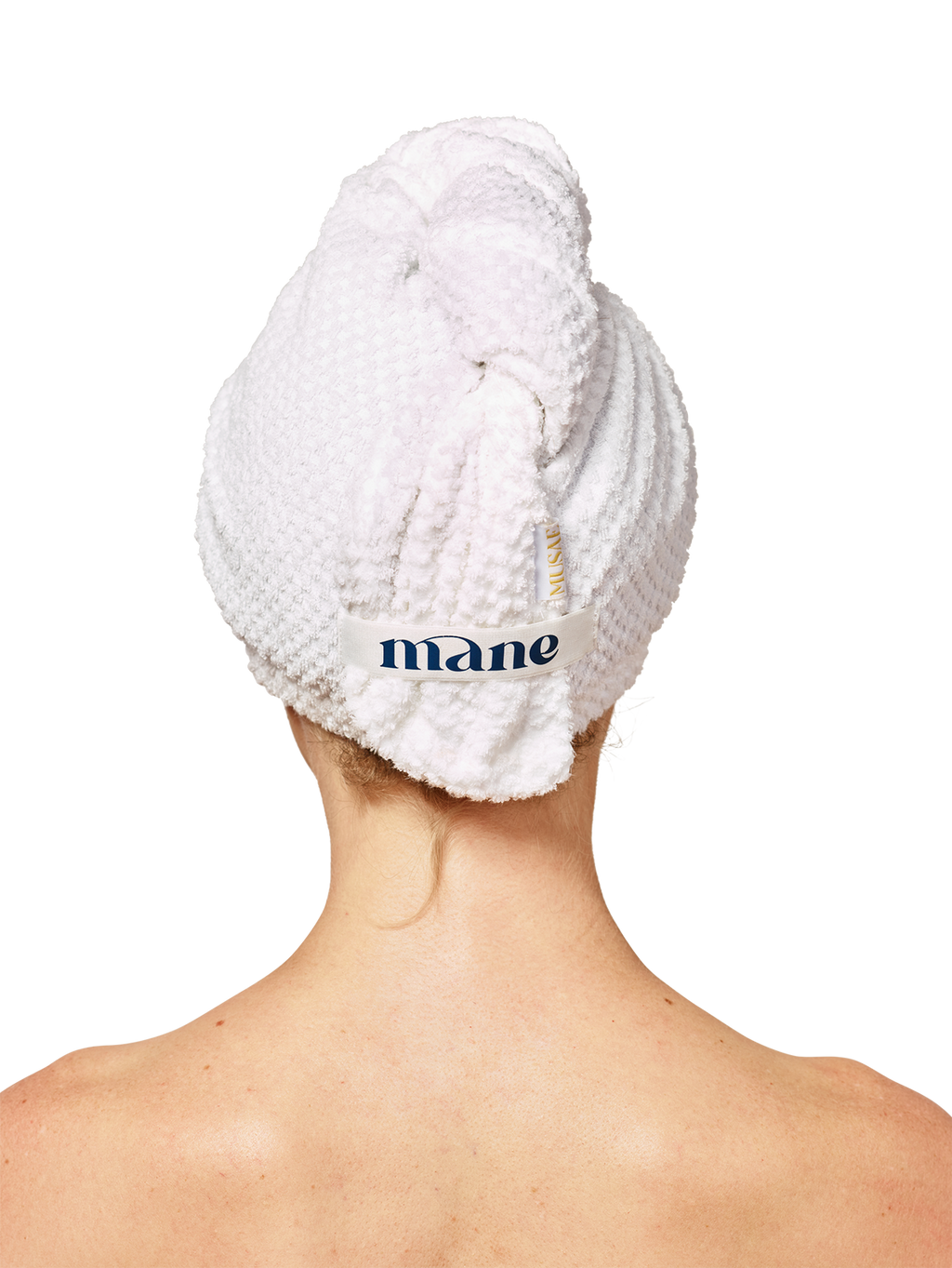 back of a persons head wearing  Musae Mane hair towel in textured pure white on a white background. 