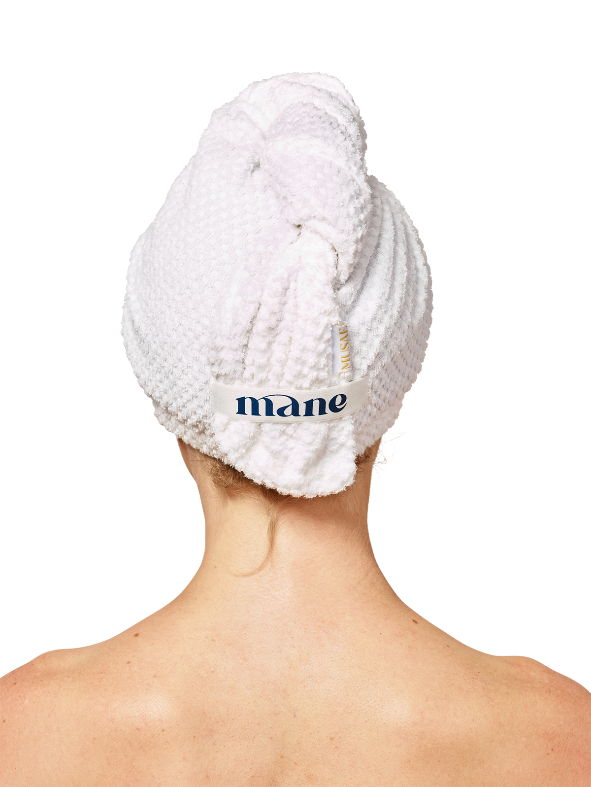 back of a persons head wearing  Musae Mane hair towel in textured pure white on a white background. 