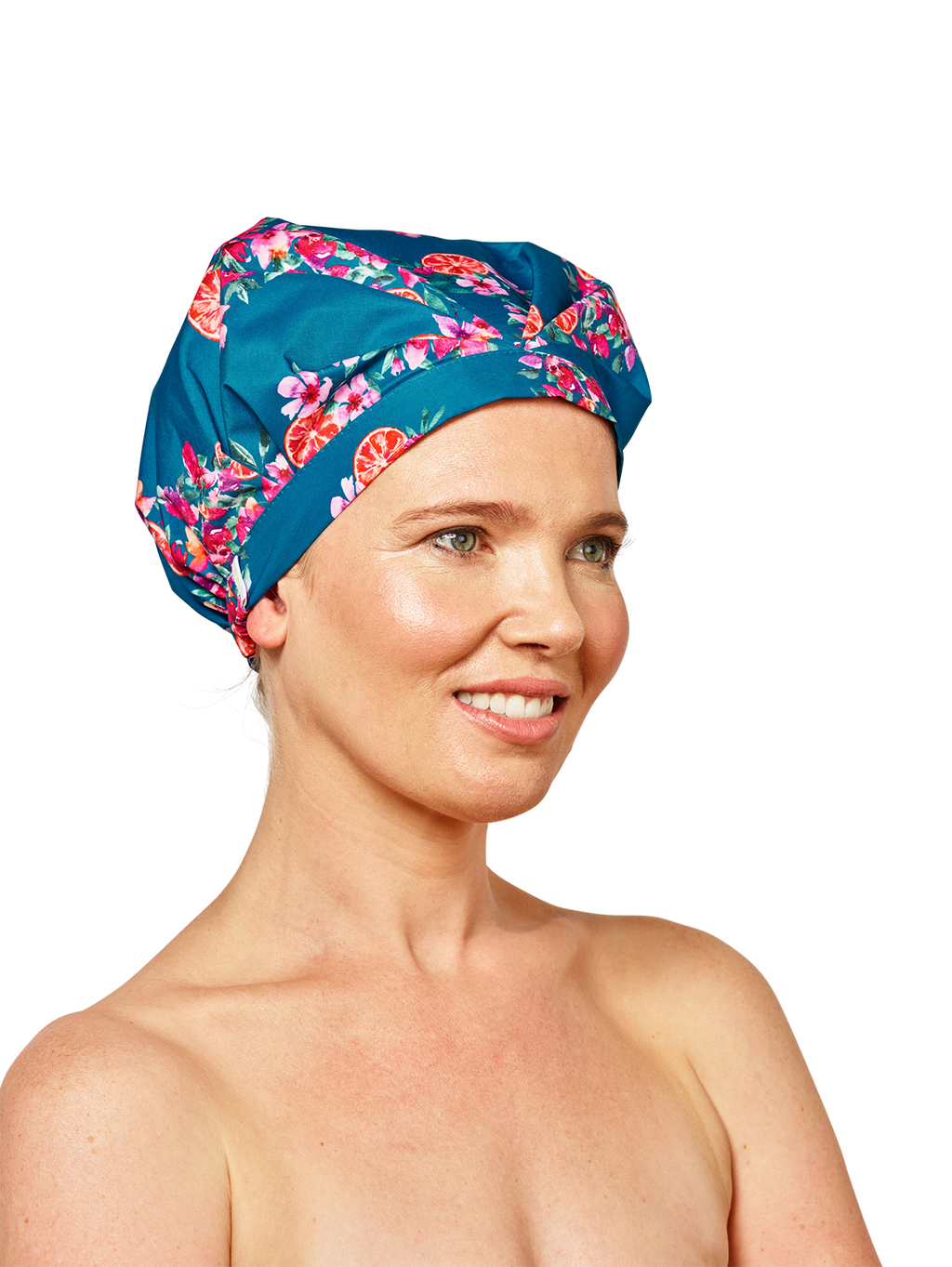 woman wearing blue musae mane shower cap in floral amalfi print on a white background