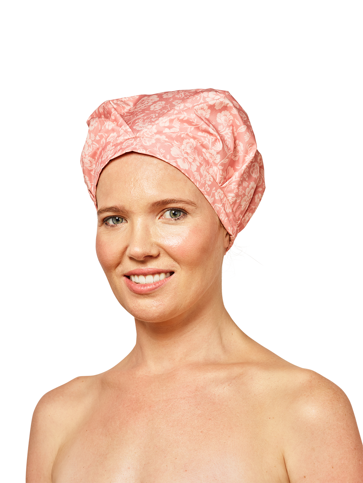 woman wearing musae mane shower cap in pink blossom print on a white background