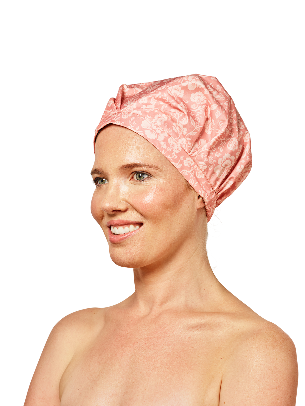 woman looking to the left wearing musae mane shower cap in pink blossom print on a white background