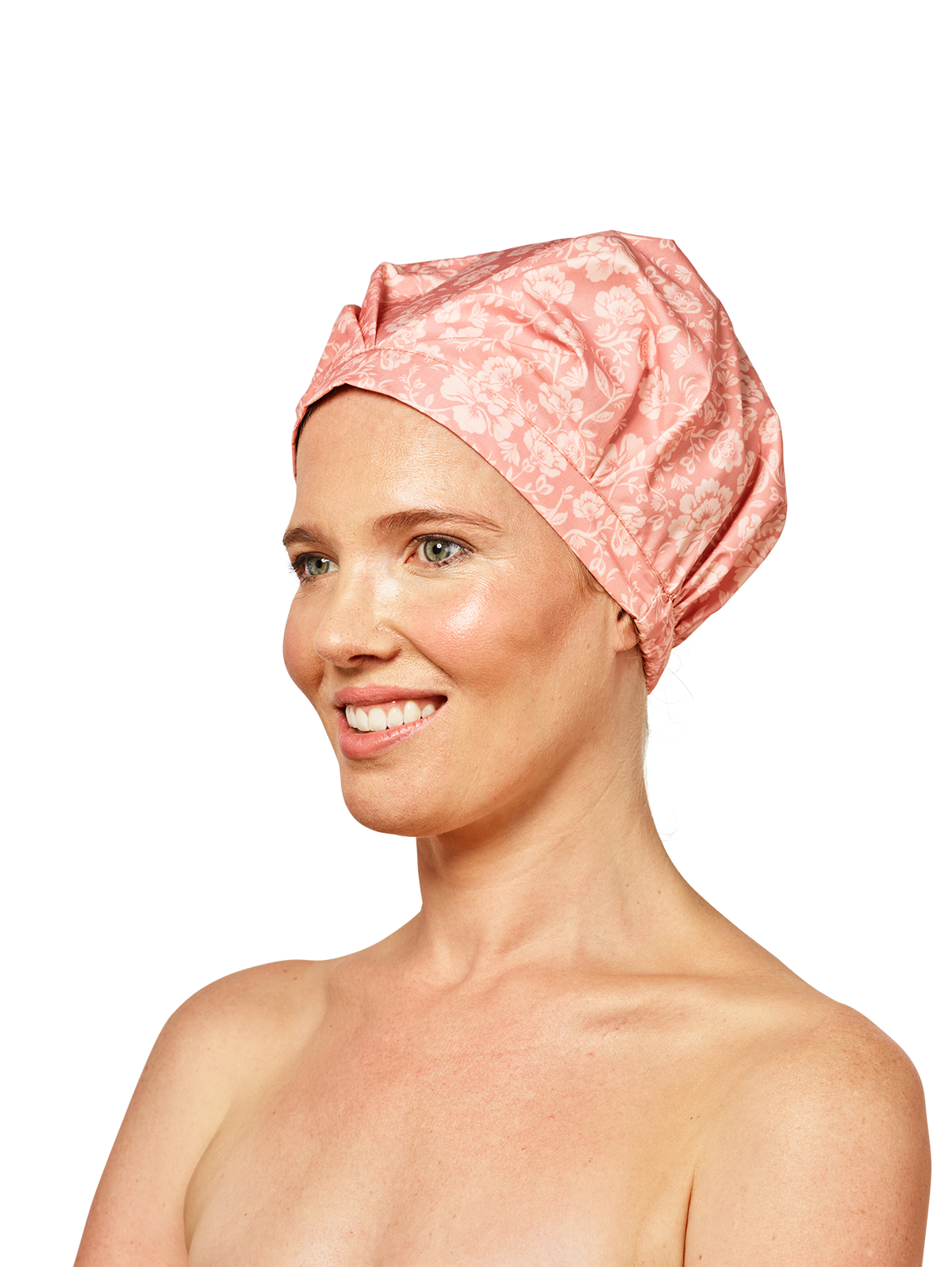woman looking to the left wearing musae mane shower cap in pink blossom print on a white background