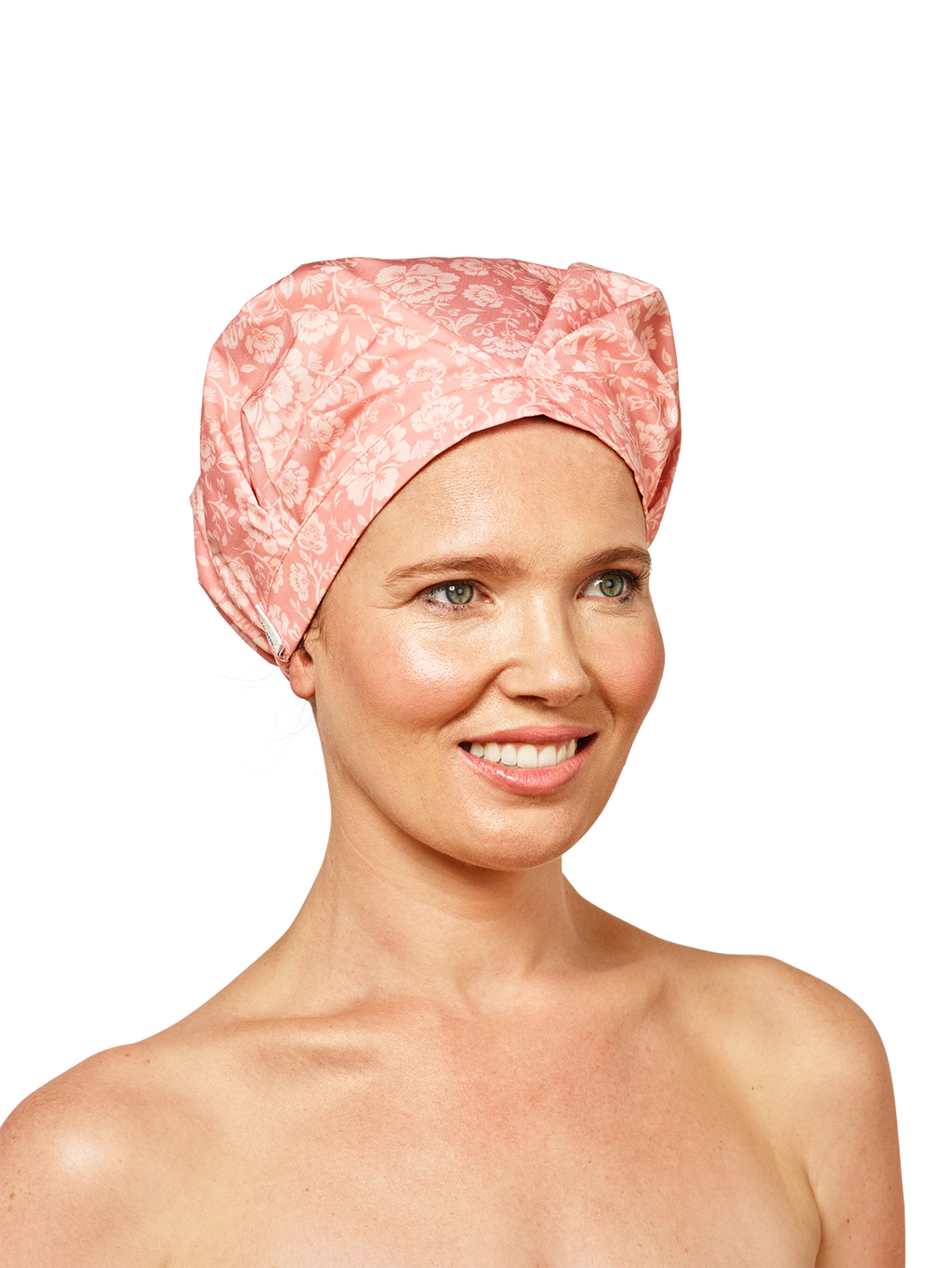 woman model looking to the right wearing musae mane shower cap in pink blossom print on a white background