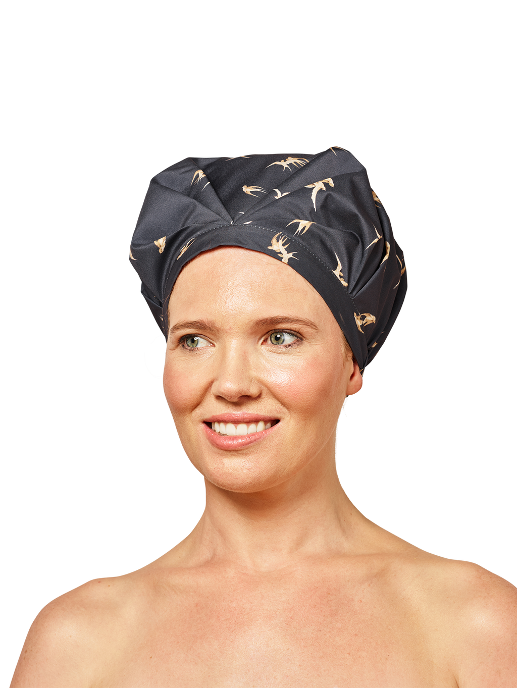female model looking to the left wearing musae mane shower cap in black songbird print on a white background