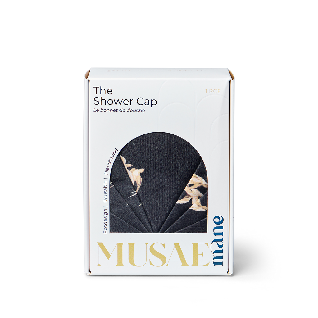 Box of Musae Mane shower cap in Songbird print on a white background