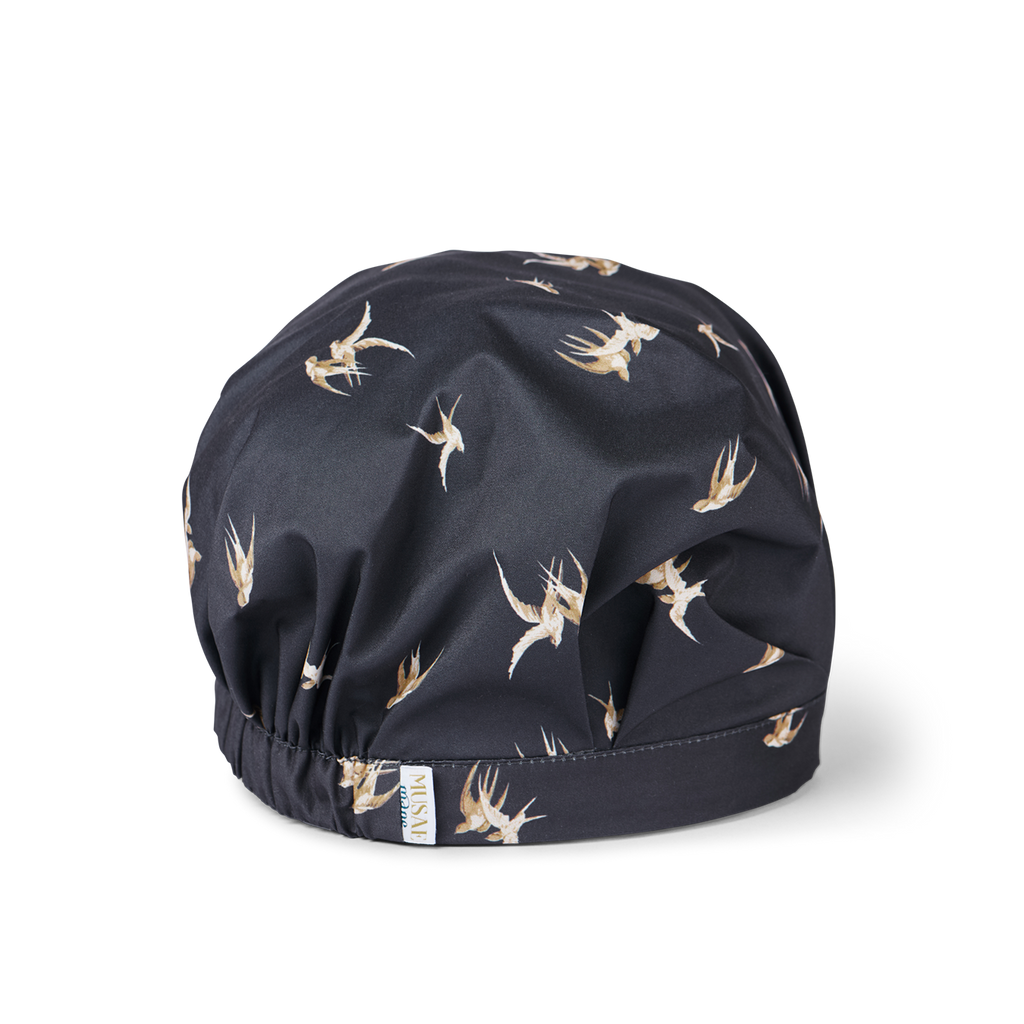 musae mane shower cap in songbird print- black with sparrow bird pattern. 