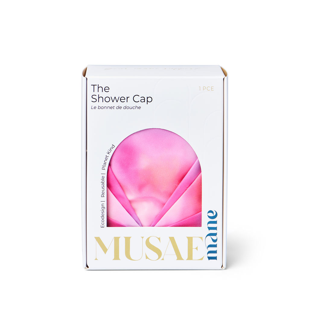 Box of Musae Mane shower cap in sunset print on a white background
